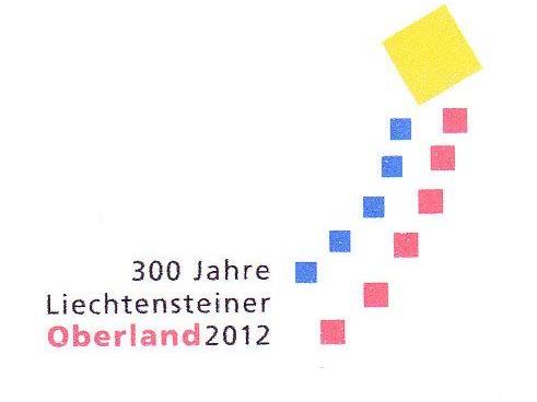 Der Jubiläumslogo-Drachen mit den roten Quadraten (Oberland) und blauen Quadraten (Unterland).