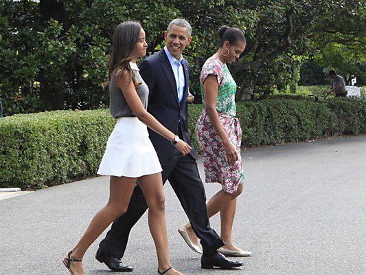 Malia Obama mit ihren Eltern