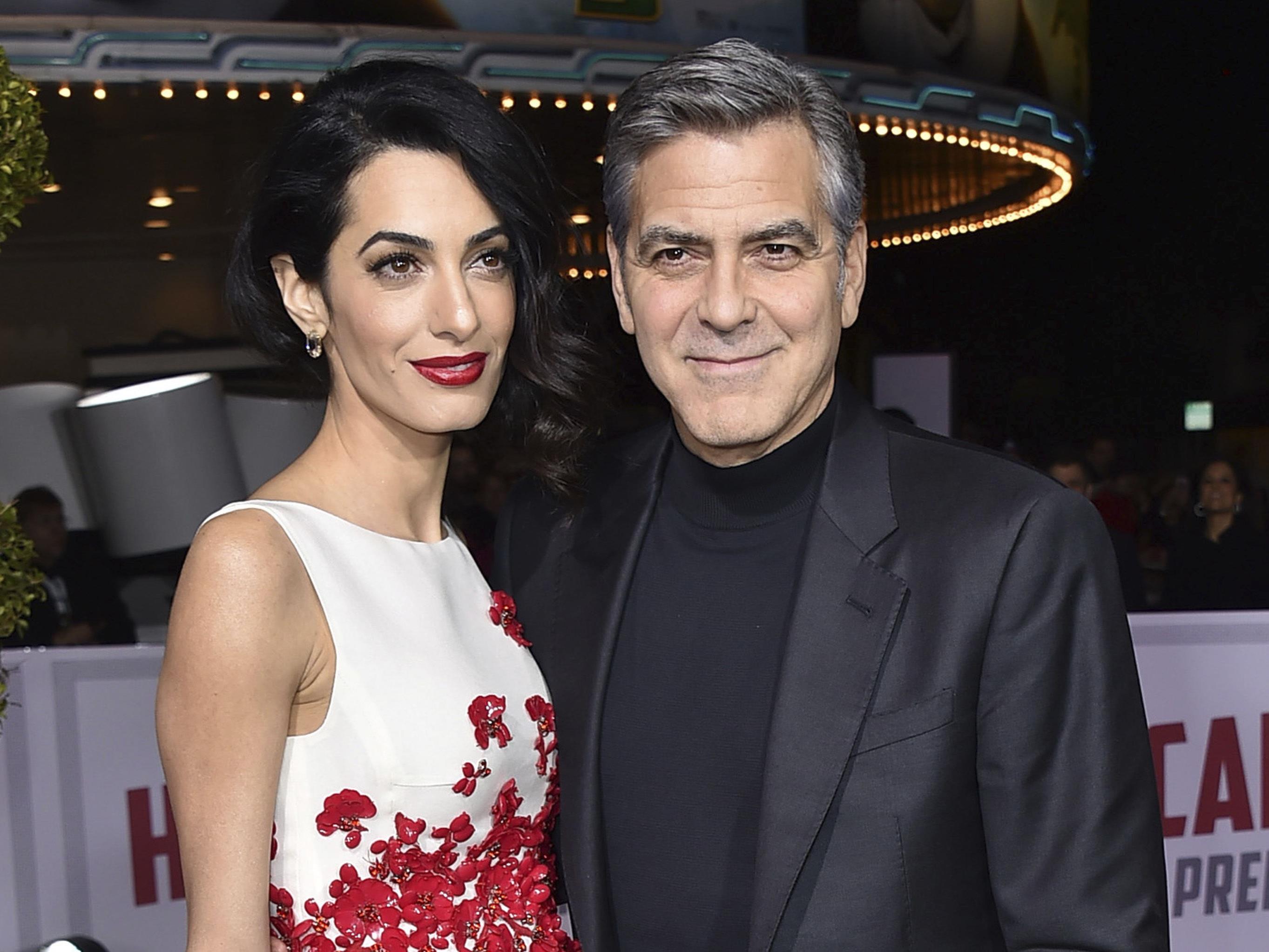 George Clooney und seine Frau Amal erwarten Medienberichten zufolge Zwillinge. George Clooney und seine Frau Amal erwarten Medienberichten zufolge Zwillinge.