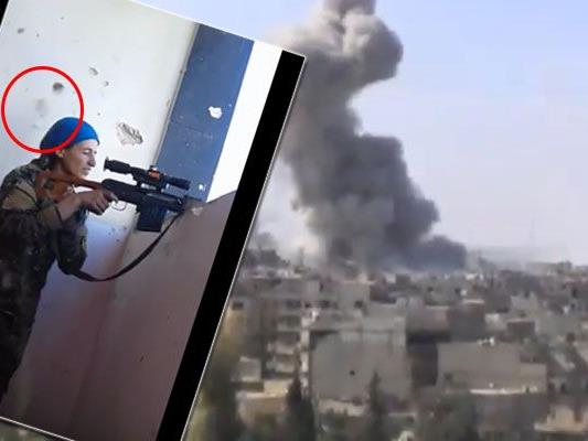 Kurden-Kämpferin wird in Raqqa nur knapp von einer Kugel verfeht.